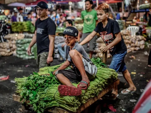 Children at a market in the Philippines